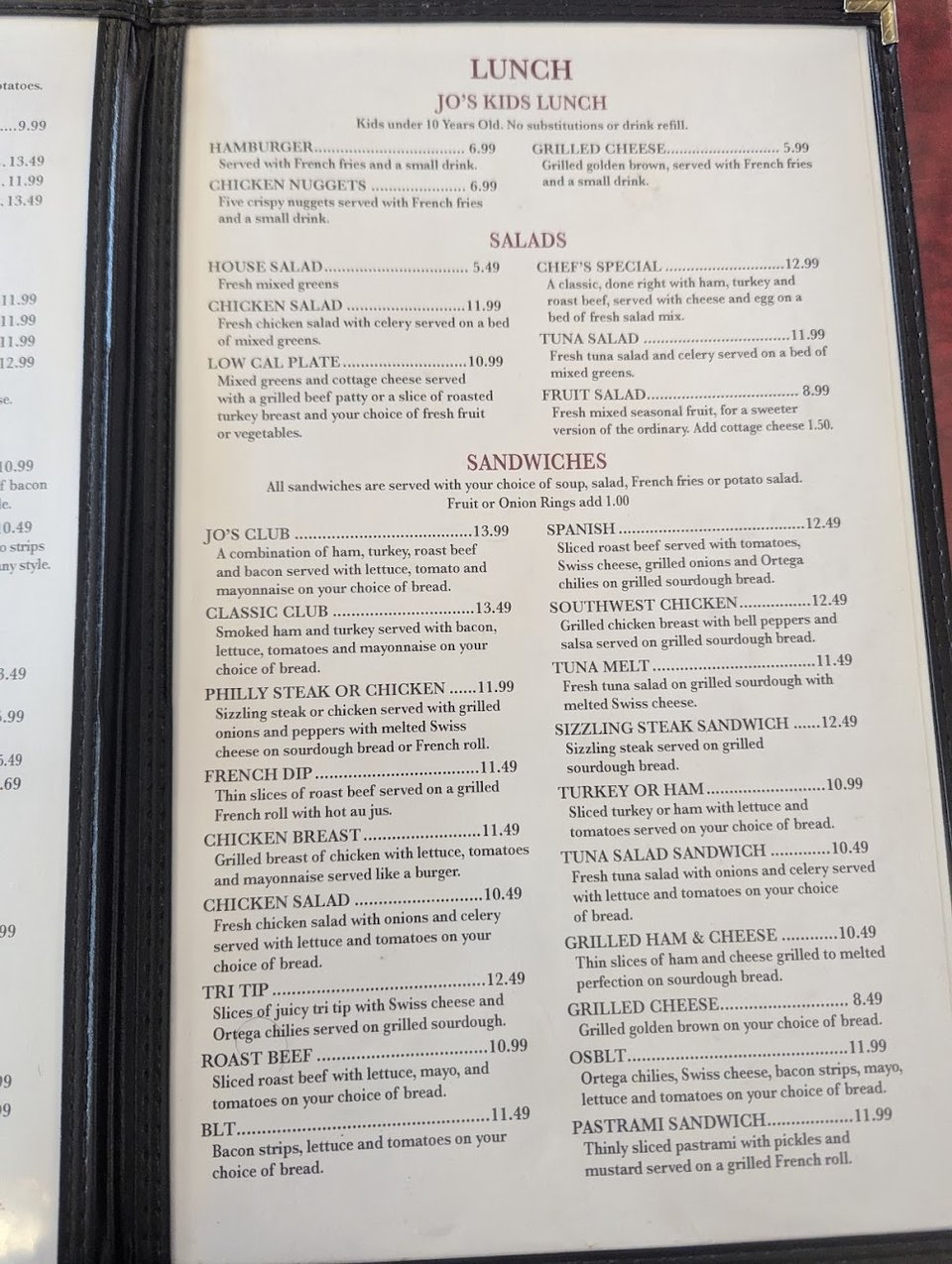 Restaurant menu showing sandwiches, salads, and kids' meals.